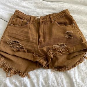 Brown distressed shorts
